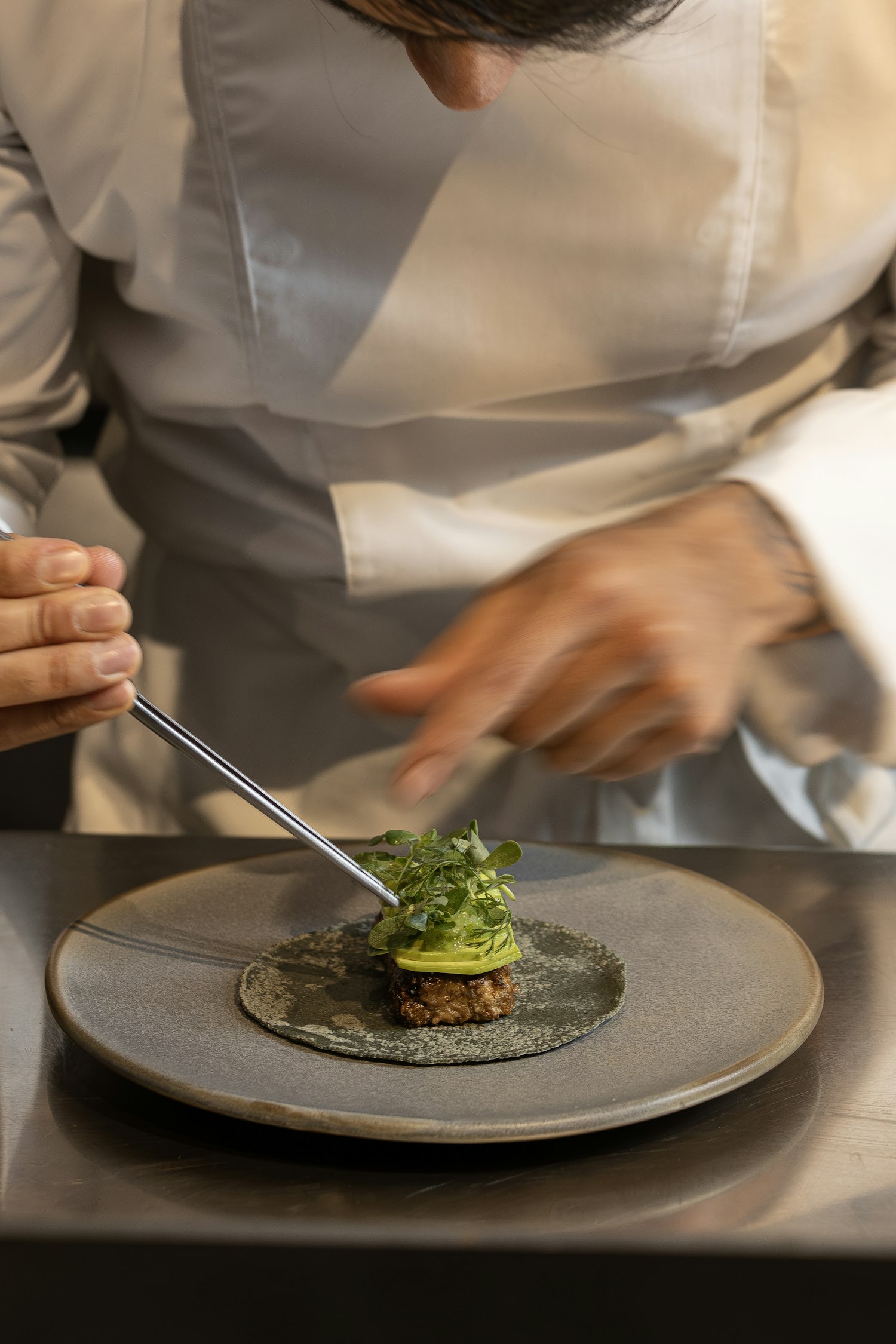 Chef plating a dish